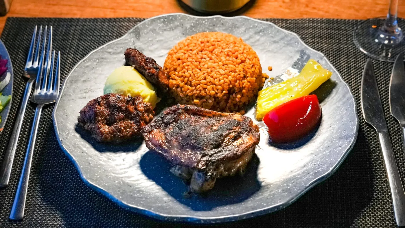 Köfte and grilled chicken with bulgur pilaf, mashed potato, grilled pepper and tomato