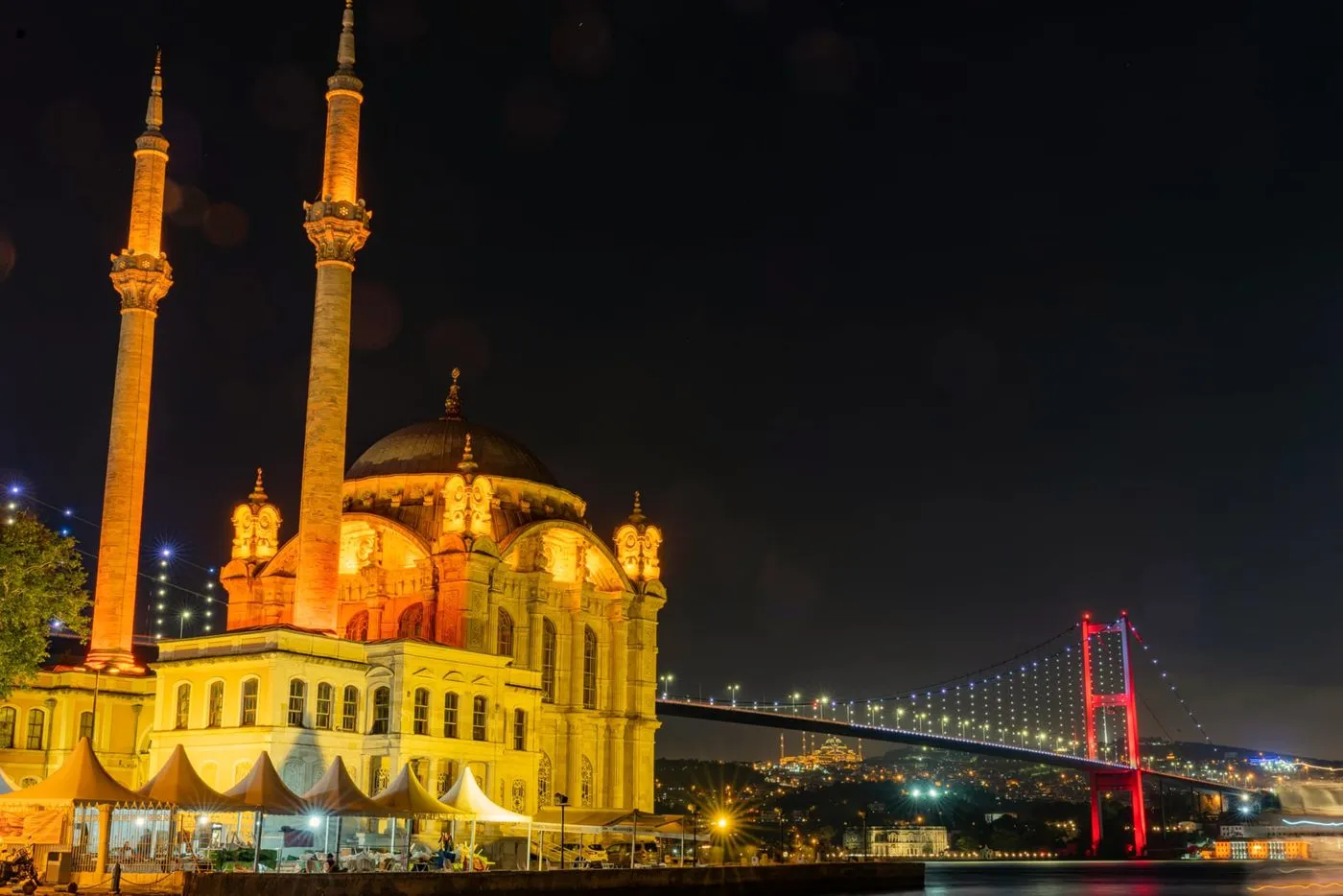 Ortaköy Mosque and the Bosphorus Bridge illuminated at night