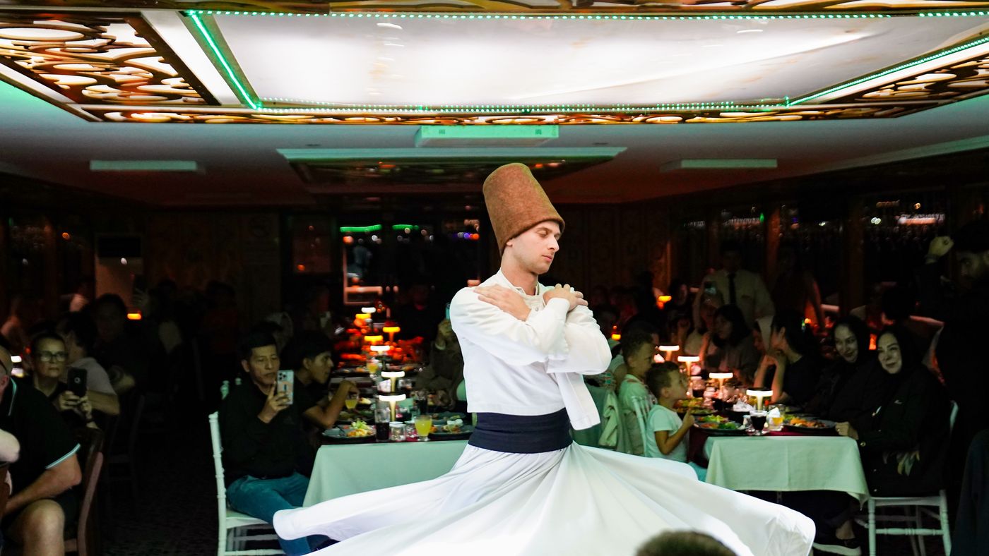 A whirling dervish turning in the dining salon