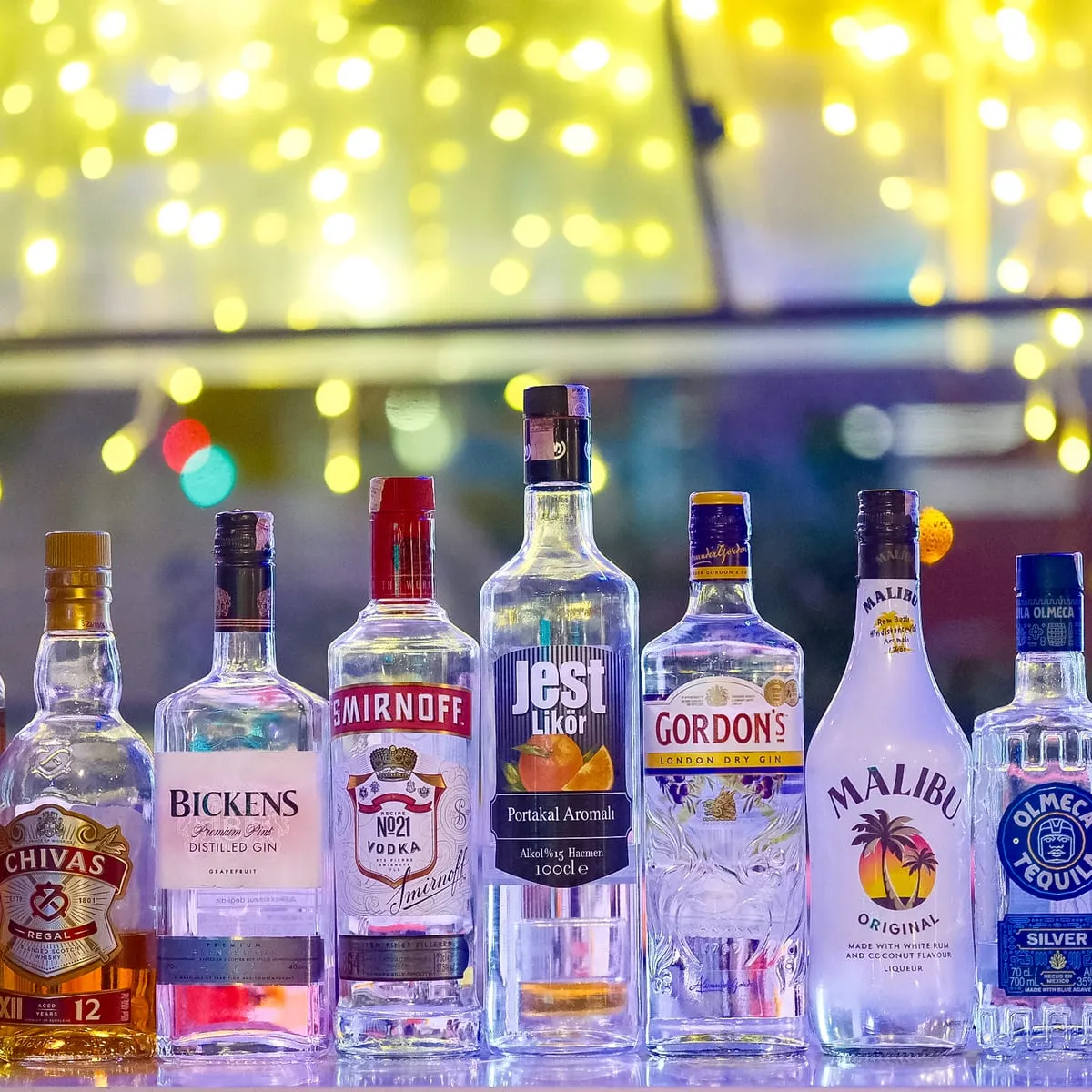 Bottles lined up at the bar on board
