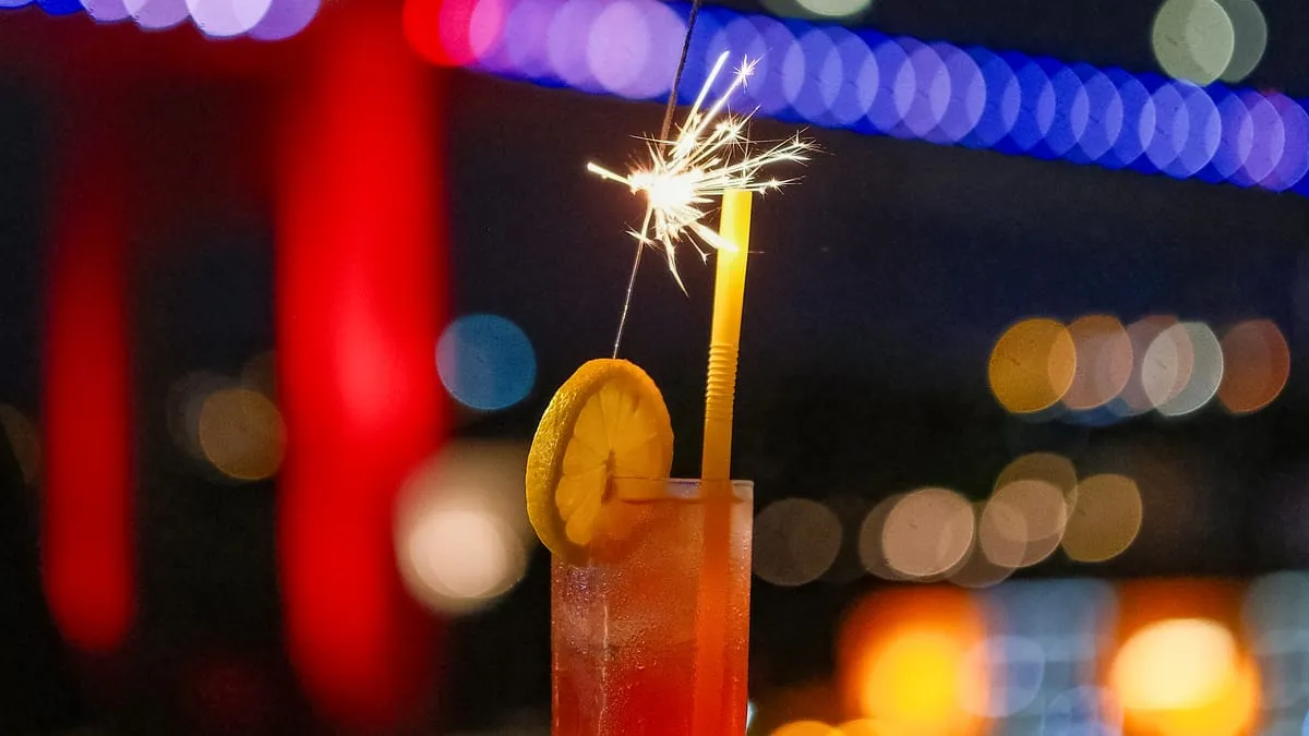 Cocktail with a sparkler served in front of the Bosphorus Bridge
