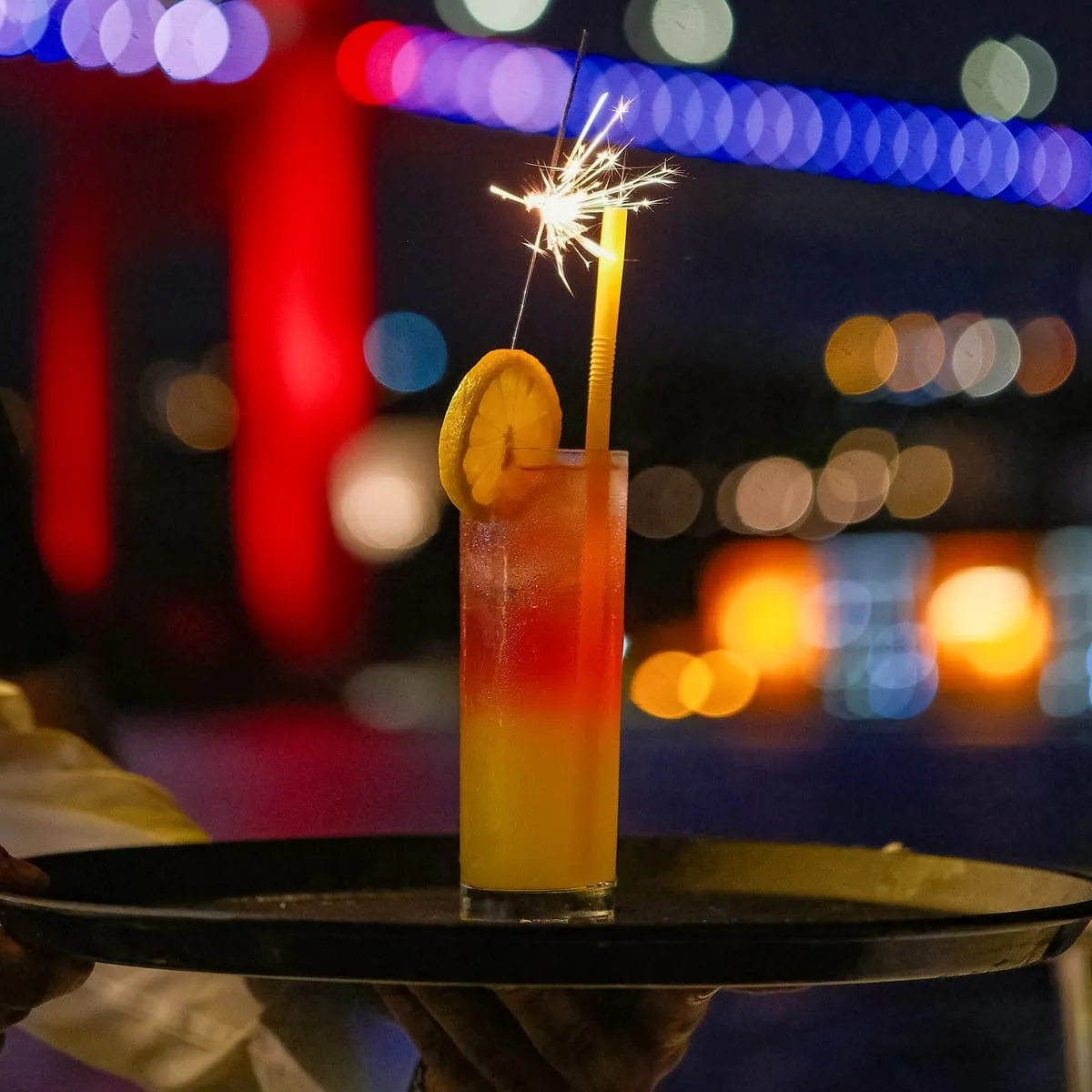 Cocktail with a sparkler in front of the Bosphorus Bridge