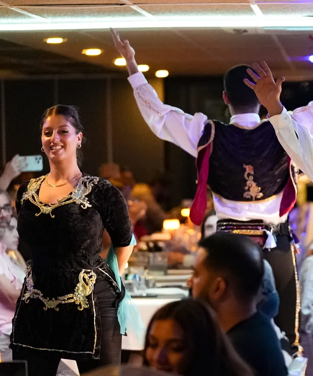 Anatolian folk dancers performing between the tables on the dinner cruise
