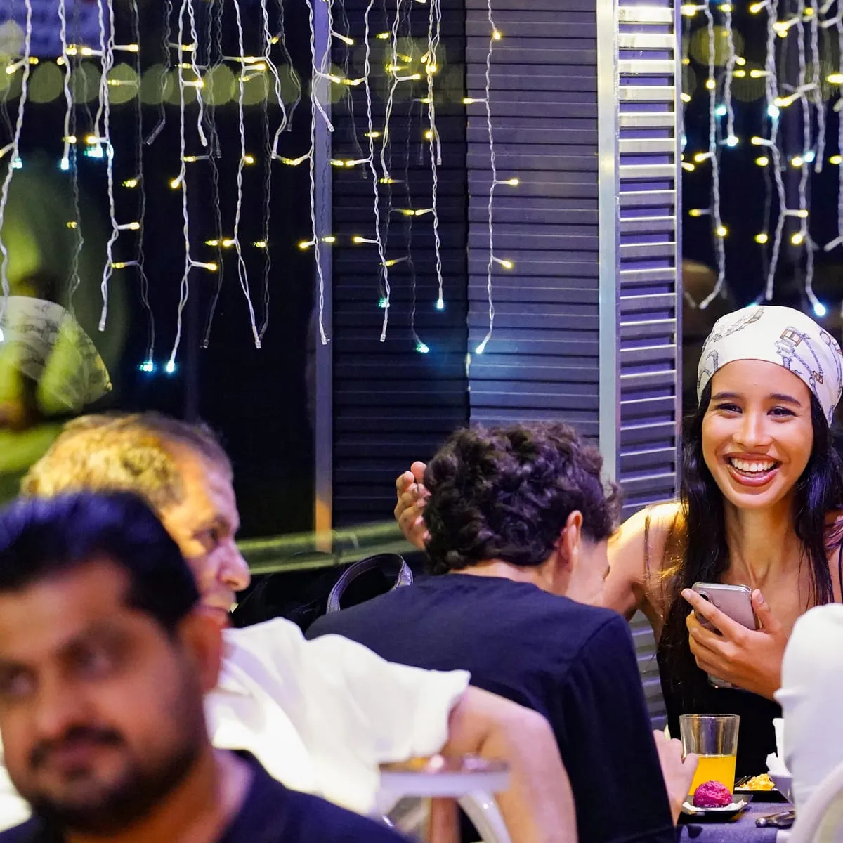 Guest laughing at the dinner table