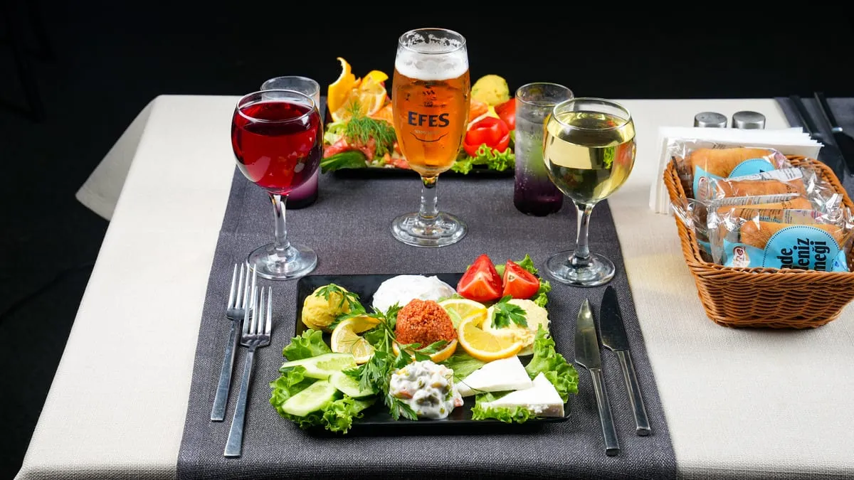 Cold meze plate served with drinks on the dinner table