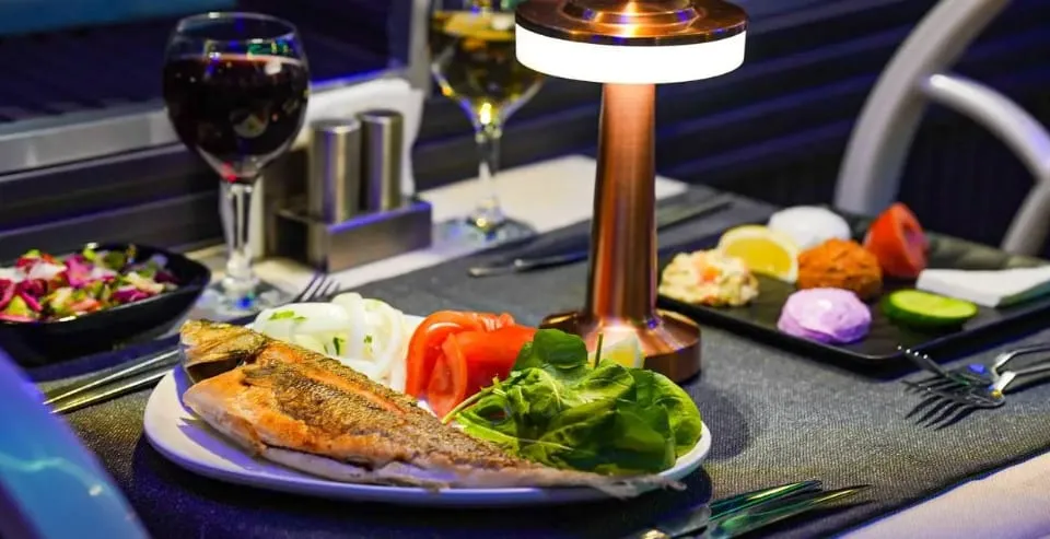 Grilled sea bass main course with salad